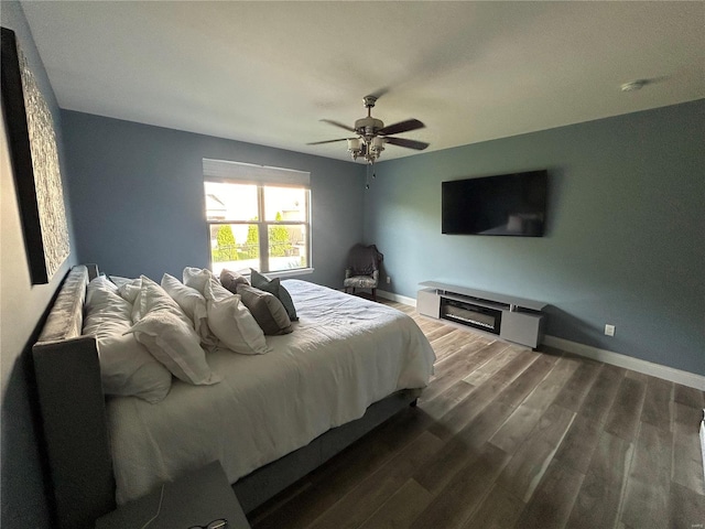 bedroom with hardwood / wood-style flooring and ceiling fan