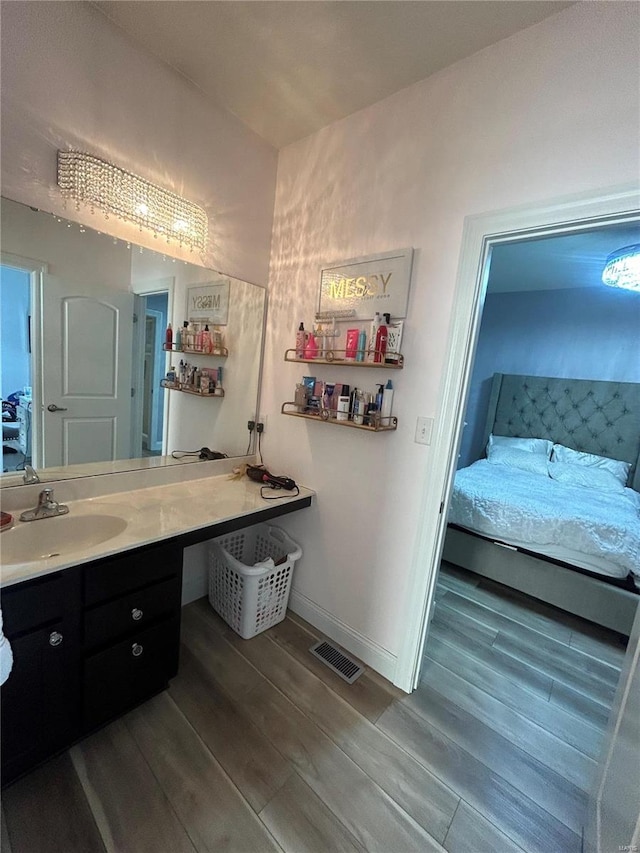 bathroom with wood-type flooring and vanity