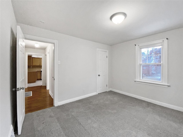 unfurnished room with carpet