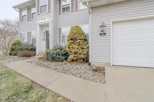 view of exterior entry with a garage