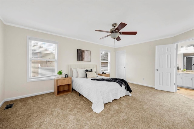 bedroom featuring multiple windows, visible vents, and light colored carpet