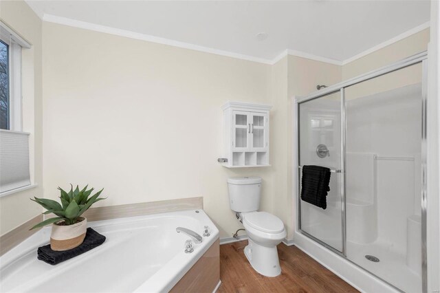 full bath featuring a garden tub, toilet, ornamental molding, a shower stall, and wood finished floors