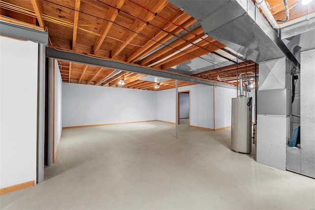 unfinished basement featuring gas water heater, baseboards, and heating unit