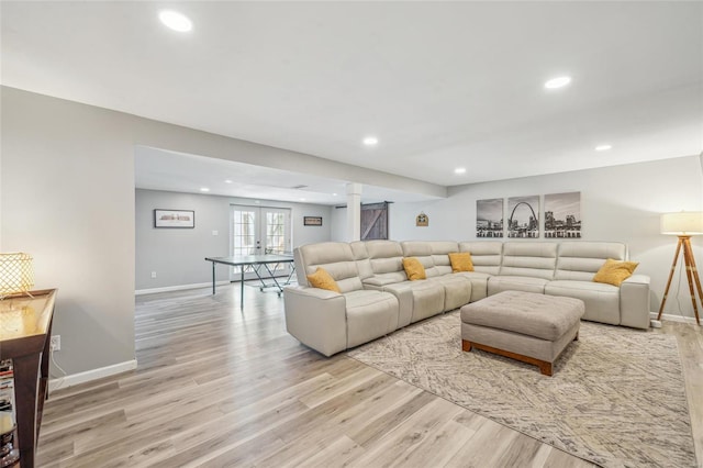 living room featuring light hardwood / wood-style flooring and french doors