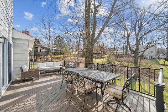 wooden deck featuring outdoor lounge area