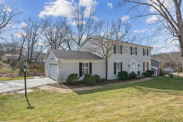 view of front of home featuring a garage and a front yard