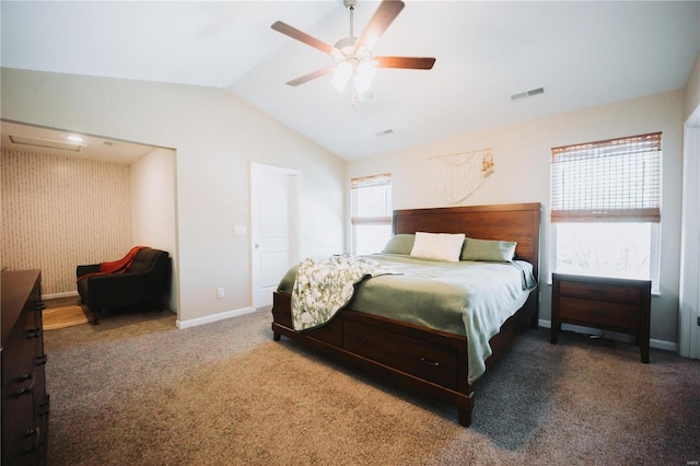 bedroom featuring ceiling fan, vaulted ceiling, and dark colored carpet