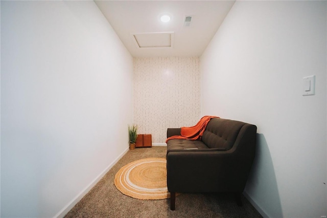 living area featuring carpet floors