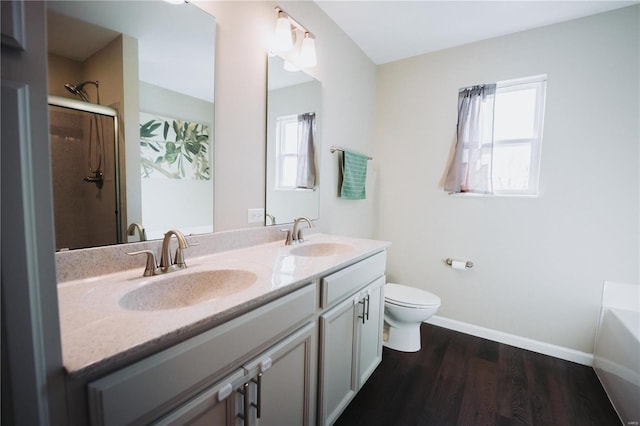 full bathroom featuring vanity, separate shower and tub, hardwood / wood-style floors, and toilet