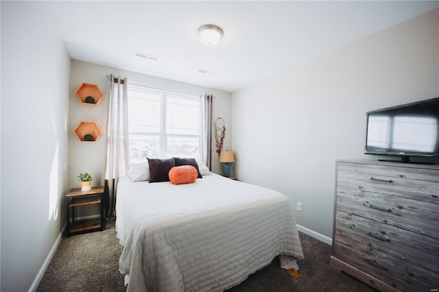 bedroom featuring dark colored carpet