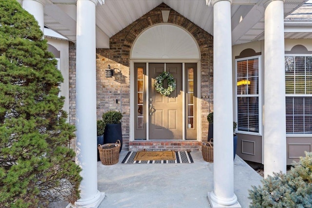 property entrance with brick siding