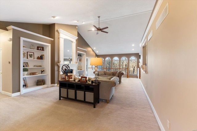 carpeted living area with ceiling fan, built in features, visible vents, and baseboards