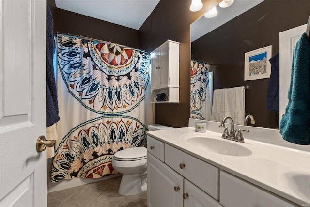 full bathroom with toilet, curtained shower, tile patterned flooring, and vanity