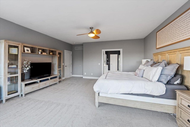 bedroom with a ceiling fan, baseboards, visible vents, and carpet flooring