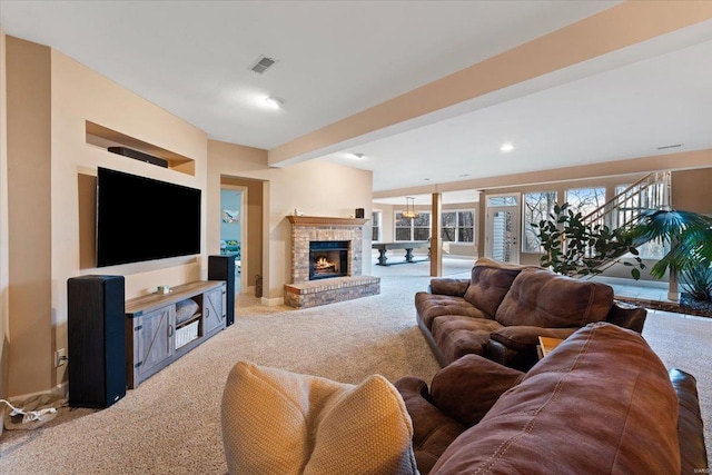 living room featuring visible vents, carpet, a fireplace, beam ceiling, and recessed lighting