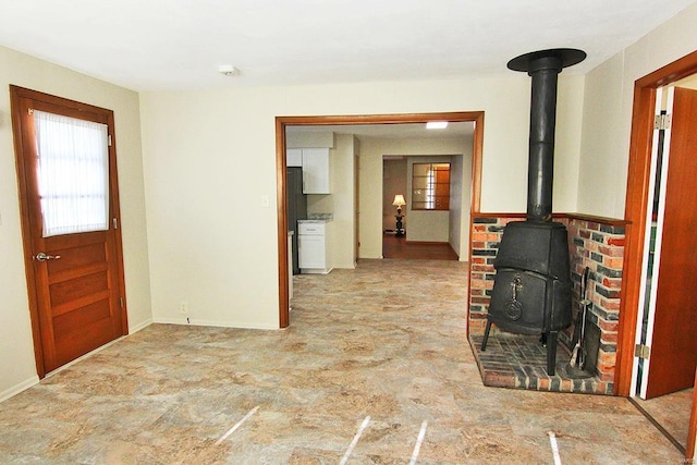 foyer featuring a wood stove