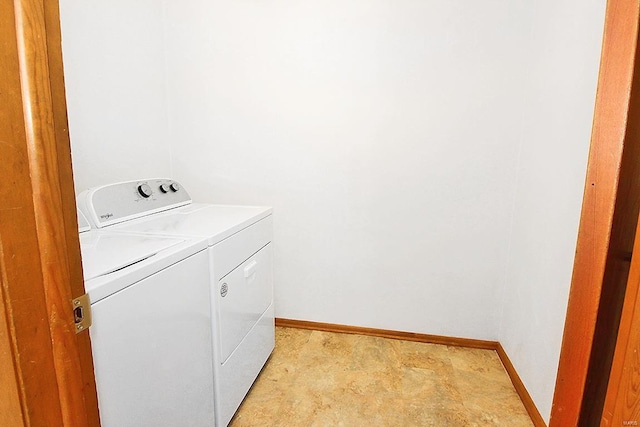 laundry room featuring washing machine and clothes dryer