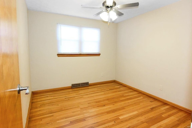 empty room featuring ceiling fan and light hardwood / wood-style floors