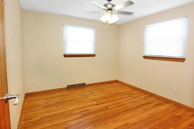 unfurnished room featuring ceiling fan and light wood-type flooring