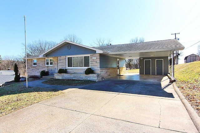 ranch-style home featuring a carport