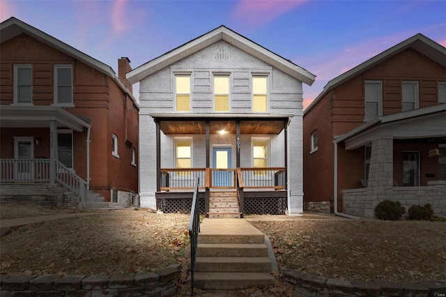 view of front of property featuring covered porch