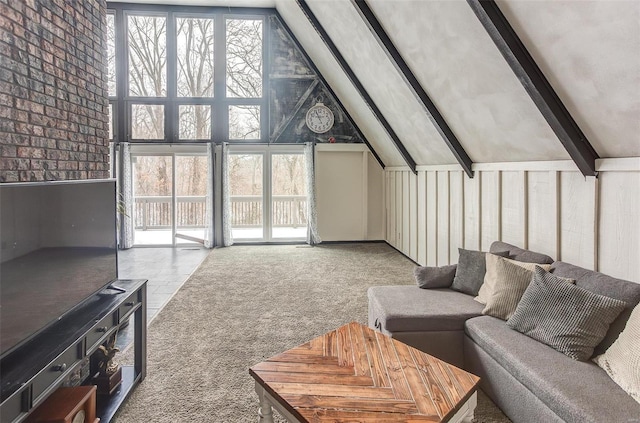 living area featuring light carpet, high vaulted ceiling, a wealth of natural light, and beamed ceiling