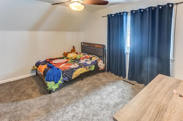 bedroom featuring a ceiling fan, baseboards, vaulted ceiling, and carpet flooring