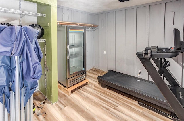 exercise area featuring light wood-style floors