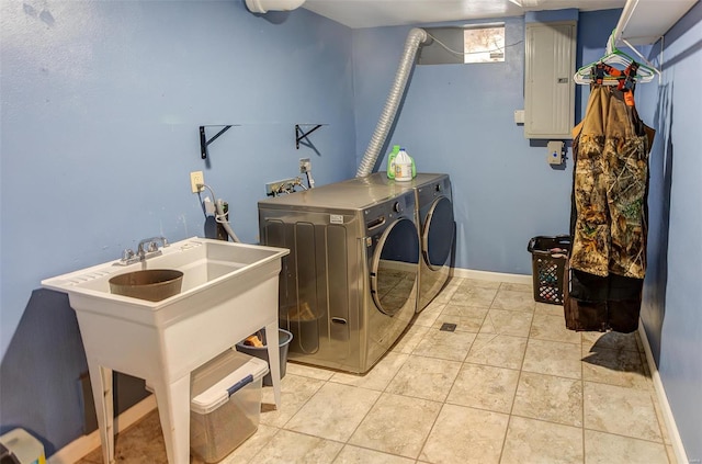 laundry room featuring baseboards, separate washer and dryer, and light tile patterned flooring