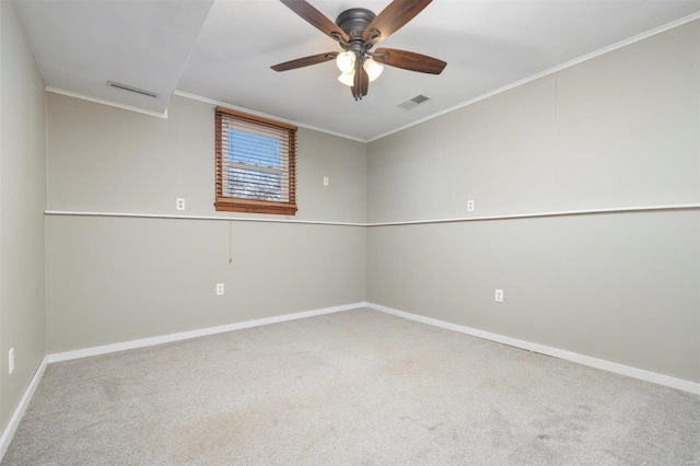 unfurnished room with crown molding, carpet, and ceiling fan