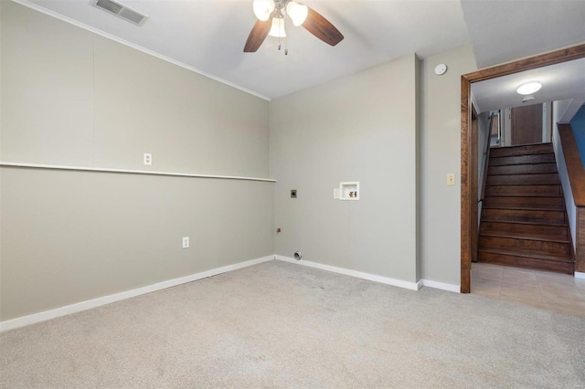 carpeted spare room featuring crown molding and ceiling fan