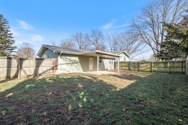 rear view of house with a patio area and a lawn