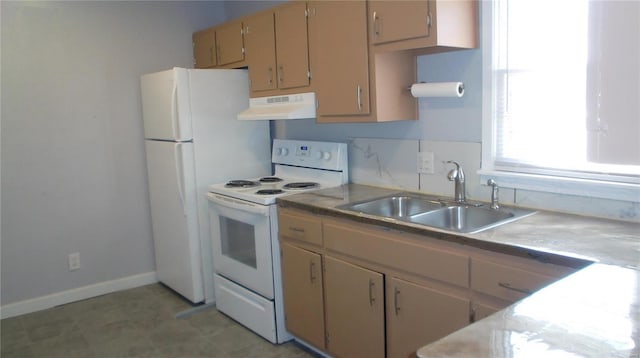 kitchen with sink and white appliances