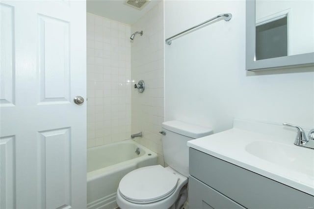 bathroom featuring toilet,  shower combination, vanity, and visible vents