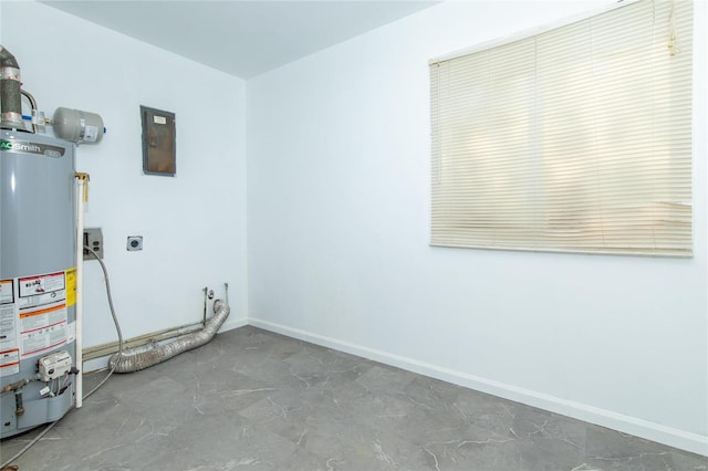 laundry room with gas water heater and hookup for an electric dryer