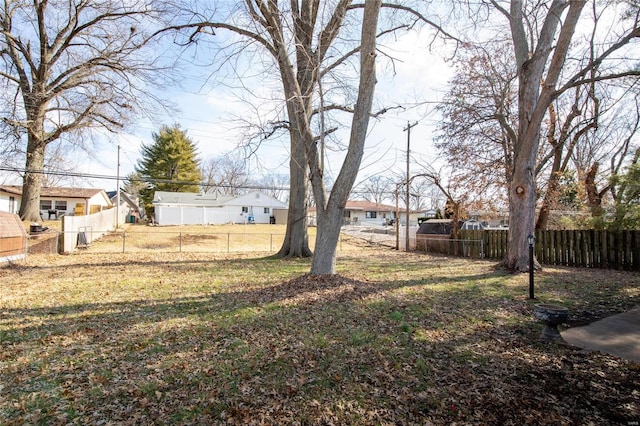 view of yard featuring fence private yard and a residential view