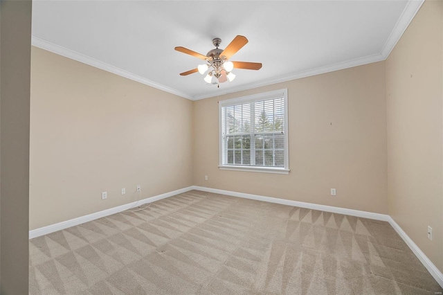 unfurnished room featuring crown molding, ceiling fan, and light carpet