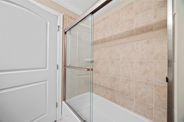 bathroom with shower / bath combination with glass door