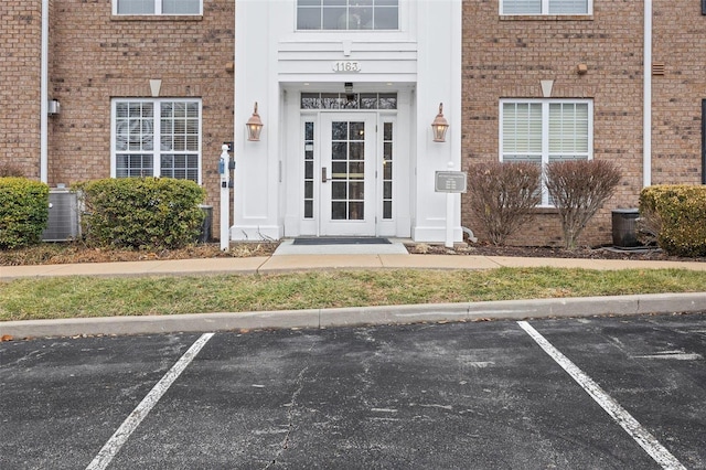 doorway to property featuring central AC