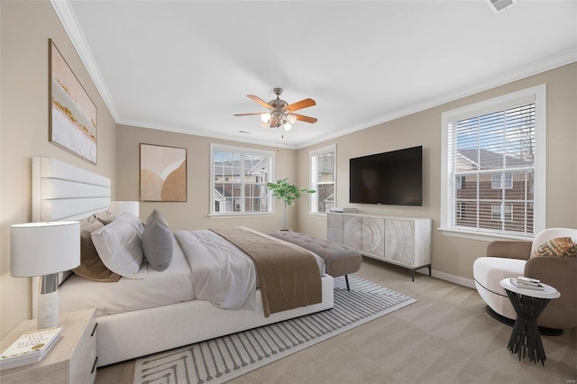 carpeted bedroom with crown molding and ceiling fan