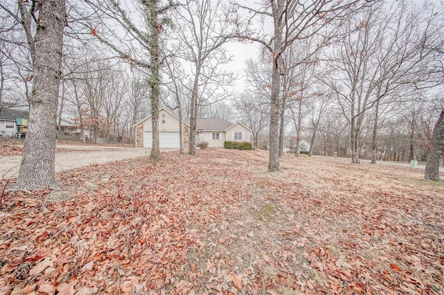 view of yard featuring a garage