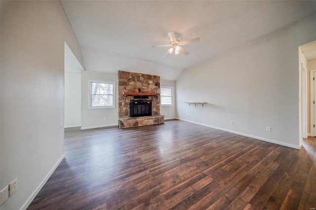 unfurnished living room with dark hardwood / wood-style flooring, a fireplace, ceiling fan, and vaulted ceiling