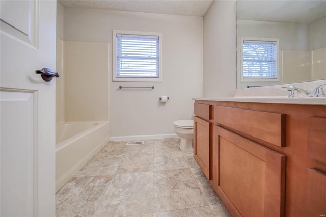 full bathroom featuring vanity, shower / bathing tub combination, a textured ceiling, and toilet