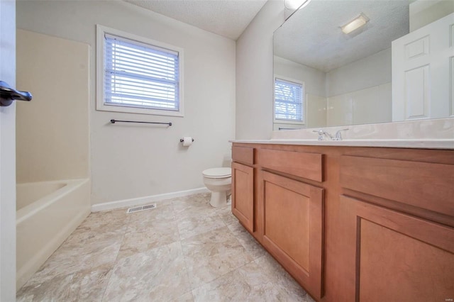 full bathroom with vanity, toilet, shower / bathing tub combination, and a textured ceiling