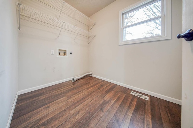 washroom featuring electric dryer hookup, dark hardwood / wood-style floors, and washer hookup