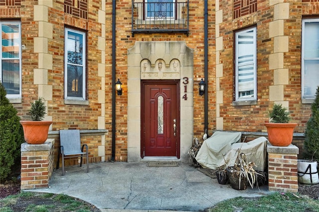 property entrance with brick siding