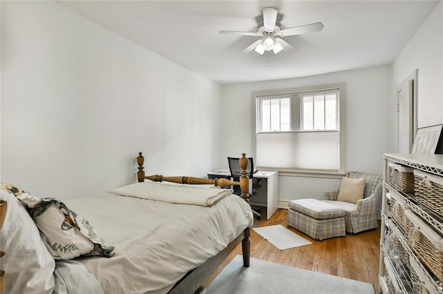 bedroom with a ceiling fan and wood finished floors