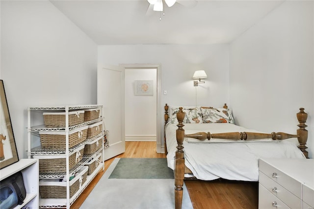 bedroom with ceiling fan and wood finished floors