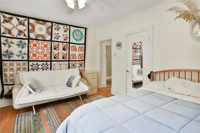 bedroom with ceiling fan and wood finished floors