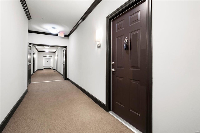 hallway featuring ornamental molding and light colored carpet